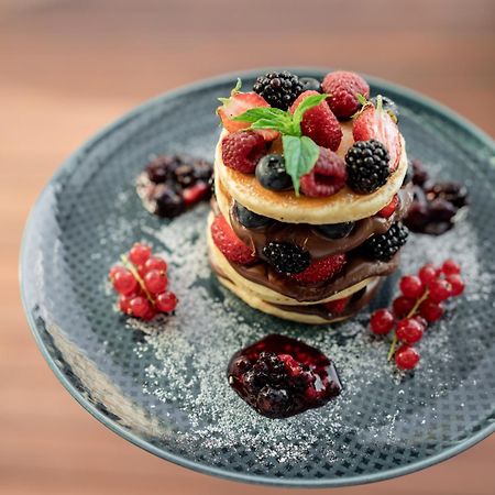 Address Istanbul酒店 外观 照片 A stack of pancakes with fruit